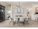 Elegant dining area with modern chandelier and stylish table for entertaining guests at 2989 N 44Th St # 3044, Phoenix, AZ 85018