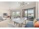 Open dining and living area showcasing stylish furniture, modern design, and balcony access at 2989 N 44Th St # 3044, Phoenix, AZ 85018