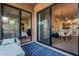 Relaxing outdoor patio offers seamless indoor-outdoor living with views into bedroom and open-concept kitchen and living space at 2989 N 44Th St # 3044, Phoenix, AZ 85018