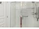 Modern shower with glass doors, sleek fixtures, and grab bars for added safety at 2989 N 44Th St # 3044, Phoenix, AZ 85018