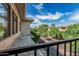 View from the balcony features tree-lined streets and well-maintained landscaping under a bright blue sky at 2989 N 44Th St # 3044, Phoenix, AZ 85018