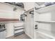 Spacious walk-in closet featuring ample shelving and hanging space for organized storage of clothing and accessories at 2989 N 44Th St # 3044, Phoenix, AZ 85018