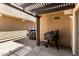 Back patio area has a grill and lattice covering at 3020 E Megan St, Gilbert, AZ 85295