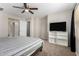 Neutral Primary bedroom with ceiling fan, TV, and ensuite bathroom access for added privacy at 3020 E Megan St, Gilbert, AZ 85295