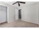 Bedroom with ceiling fan, closet, and neutral paint. Offers a serene atmosphere for relaxation at 3020 E Megan St, Gilbert, AZ 85295