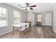 Bright dining area features modern table set, fan, and wood-look flooring at 3020 E Megan St, Gilbert, AZ 85295