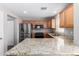 Kitchen featuring granite countertops, stainless steel appliances, and stylish cabinets at 3020 E Megan St, Gilbert, AZ 85295