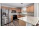 Kitchen with stainless steel appliances, granite countertops, and wood cabinets at 3020 E Megan St, Gilbert, AZ 85295