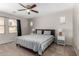 Spacious main bedroom features a ceiling fan and a large window with natural light at 3020 E Megan St, Gilbert, AZ 85295