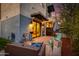 Relaxing backyard patio featuring comfortable seating, modern decor, and ambient lighting for evening enjoyment at 340 E Osborn Rd # 1, Phoenix, AZ 85012