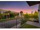 Modern balcony view with cityscape and sunset featuring an outdoor seating area and minimalist design at 340 E Osborn Rd # 1, Phoenix, AZ 85012