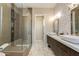 Contemporary bathroom featuring a glass-enclosed shower, dual sinks, and modern fixtures with stylish design at 340 E Osborn Rd # 1, Phoenix, AZ 85012