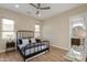 Bright and airy bedroom featuring a queen-sized bed and a view to the ensuite bathroom with ample natural light at 340 E Osborn Rd # 1, Phoenix, AZ 85012
