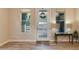 Bright entryway with a modern front door, complemented by stylish decor and wood-look flooring at 340 E Osborn Rd # 1, Phoenix, AZ 85012