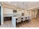 Sleek kitchen featuring modern cabinetry, quartz countertops, stainless appliances, and island seating at 340 E Osborn Rd # 1, Phoenix, AZ 85012
