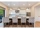 Contemporary kitchen featuring white cabinets, stainless steel appliances, and a large island with seating at 340 E Osborn Rd # 1, Phoenix, AZ 85012