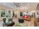 Open concept living room featuring modern decor, abundant natural light, and access to the outdoor area at 340 E Osborn Rd # 1, Phoenix, AZ 85012