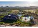 Stunning aerial view showcasing the community pool, splash pad, and clubhouse amenities at 3551 W Hidden Mountain Ln, Anthem, AZ 85086