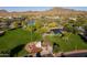 Breathtaking aerial view of the community park, pond, green space and monuments at 3551 W Hidden Mountain Ln, Anthem, AZ 85086