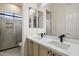 Bathroom featuring a double vanity, granite countertops, and a walk-in shower at 3551 W Hidden Mountain Ln, Anthem, AZ 85086