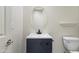 Chic powder room featuring a stylish vanity, elegant mirror, and modern fixtures at 3551 W Hidden Mountain Ln, Anthem, AZ 85086