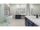 Bright bathroom featuring a freestanding tub, walk-in shower, and double vanity with modern fixtures at 3551 W Hidden Mountain Ln, Anthem, AZ 85086