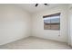 Empty bedroom with neutral walls, tile flooring, and one window with wood blinds at 3551 W Hidden Mountain Ln, Anthem, AZ 85086