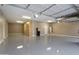 Spacious garage featuring epoxy flooring, built-in cabinets, and ample storage space at 3551 W Hidden Mountain Ln, Anthem, AZ 85086