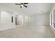 Expansive living room featuring tile flooring and neutral walls, offering versatile design options at 3551 W Hidden Mountain Ln, Anthem, AZ 85086