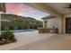 Outdoor space featuring a pool, with an outdoor kitchen and dining area, perfect for entertaining at 3551 W Hidden Mountain Ln, Anthem, AZ 85086