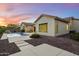 A backyard view featuring a sparkling pool, desert landscaping, and an outdoor kitchen area at 3551 W Hidden Mountain Ln, Anthem, AZ 85086