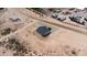 Bird's eye view of a new single-story home, rock driveway and desert surroundings at 3887 S 331St Ave, Tonopah, AZ 85354