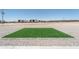 Well-manicured backyard with artificial turf, offering a low-maintenance and appealing outdoor space at 3887 S 331St Ave, Tonopah, AZ 85354