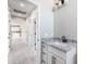 Bathroom vanity showcasing granite countertops, cabinetry and hall leading to other rooms at 3887 S 331St Ave, Tonopah, AZ 85354
