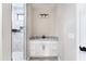 Bathroom with granite countertops, white cabinets, and white tile shower at 3887 S 331St Ave, Tonopah, AZ 85354