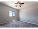 Bedroom featuring carpet floors, ceiling fan, and a bright window at 3887 S 331St Ave, Tonopah, AZ 85354