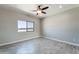 Bedroom featuring wood-look tile flooring and a ceiling fan at 3887 S 331St Ave, Tonopah, AZ 85354