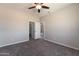 Bedroom featuring carpet floors, ceiling fan, and closet at 3887 S 331St Ave, Tonopah, AZ 85354