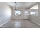 Dining room features wood-look tile flooring, chandelier and natural light at 3887 S 331St Ave, Tonopah, AZ 85354
