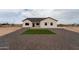 Charming single-story home featuring desert landscaping, gray gravel, and a cozy front lawn square at 3880 S 331St Ave, Tonopah, AZ 85354