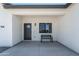 Charming front entrance featuring a black front door, bench, and window at 3887 S 331St Ave, Tonopah, AZ 85354