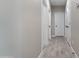Hallway features wood-look tile flooring, white doors and trim, and neutral-toned walls at 3887 S 331St Ave, Tonopah, AZ 85354