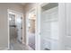 Hallway shot leading to bedroom and bathroom with doorway to storage space at 3887 S 331St Ave, Tonopah, AZ 85354