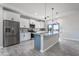 Modern kitchen featuring stainless steel appliances and a large center island at 3887 S 331St Ave, Tonopah, AZ 85354