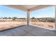 Covered patio overlooking the expansive desert yard and distant views at 3887 S 331St Ave, Tonopah, AZ 85354