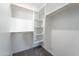 Walk-in closet with custom shelves and carpet floors at 3887 S 331St Ave, Tonopah, AZ 85354