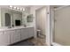Bright bathroom features double sinks, white cabinets, and a separate toilet and shower area at 4245 E Shannon St, Gilbert, AZ 85295