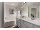 Primary bathroom with dual sinks, vanity, and soaker tub at 4245 E Shannon St, Gilbert, AZ 85295