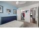 Bedroom with blue accent wall, closet and door to another room at 4245 E Shannon St, Gilbert, AZ 85295