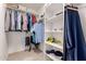 Walk-in closet provides ample storage with shelving and hanging space for clothes and accessories at 4245 E Shannon St, Gilbert, AZ 85295